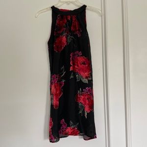 Black halter dress with red velvet appliqués